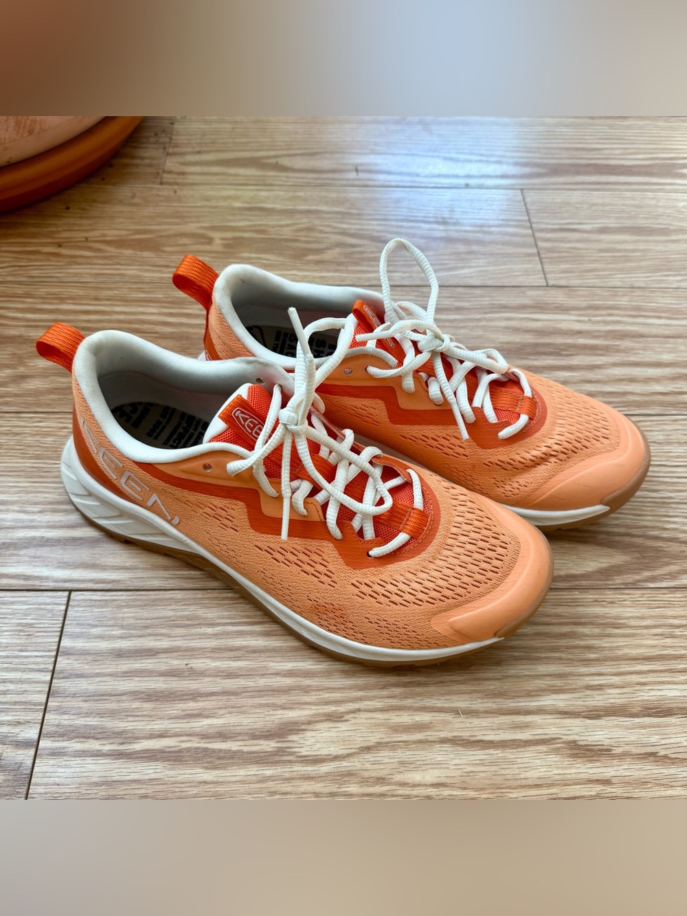 Keen women’s running shoes, orange